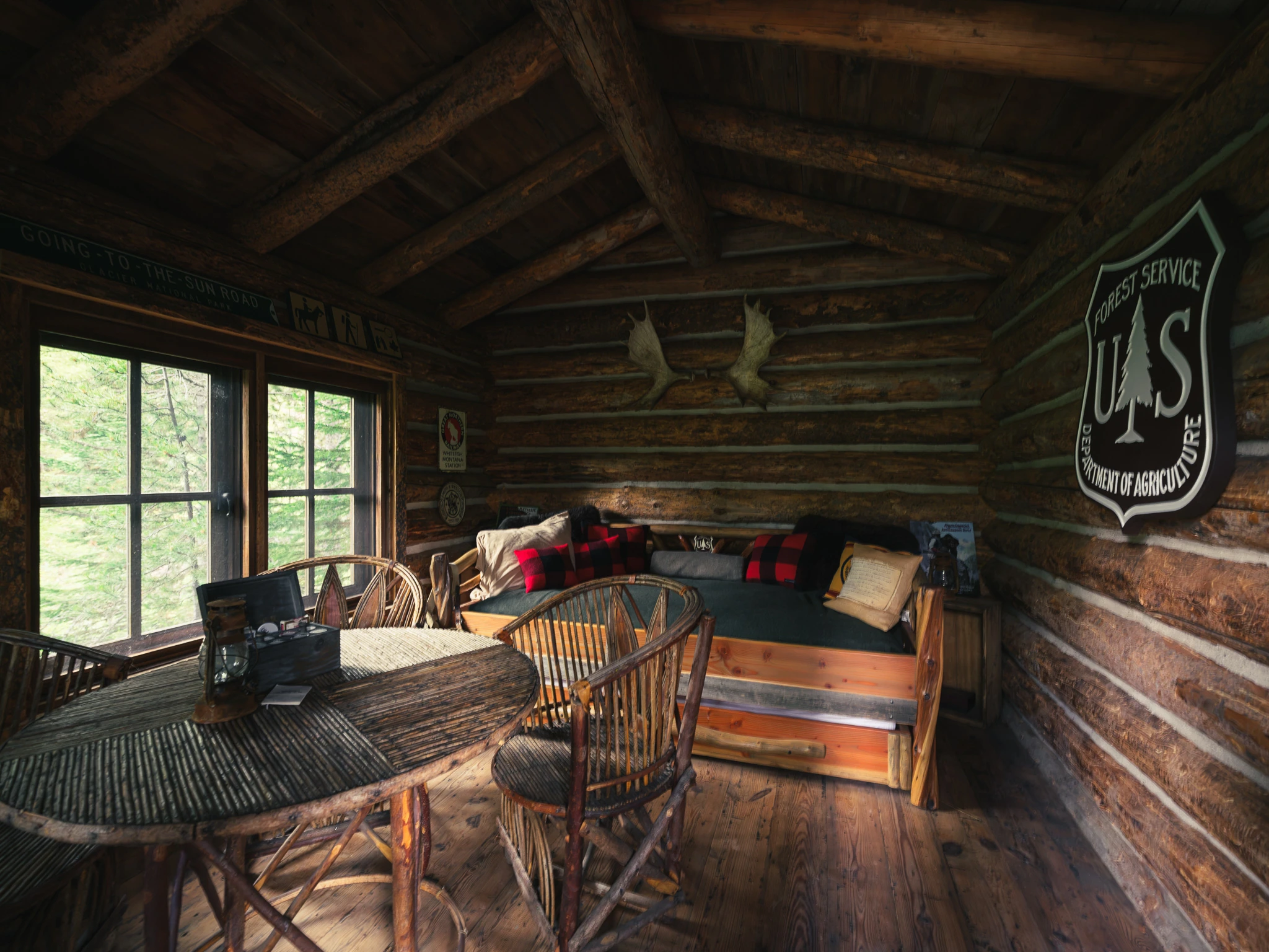 Bunk room with vintage Forest Service sign — interior design photography Big Sky Montana, Lohss Construction